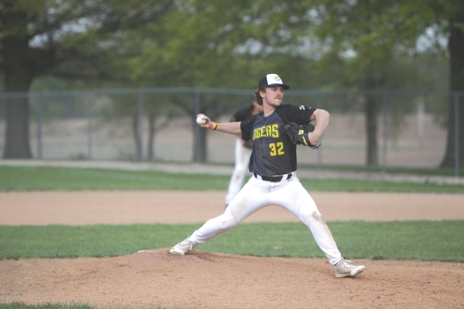 Wellsville-Middletown senior Lucas Moore delivers a pitch against Montgomery County on April 25.