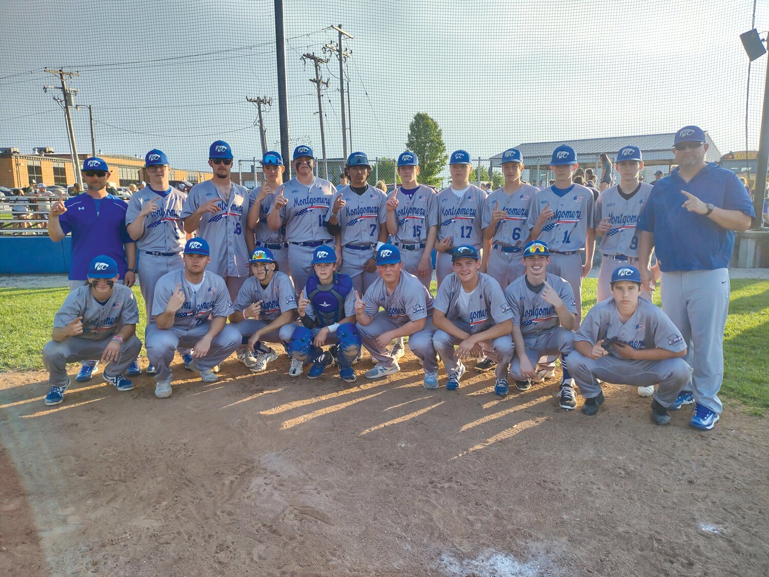 The Montgomery County Wildcats pose at home plate after beating North Callaway 7-0 on May 8 that clinched them a share of the Eastern Missouri Conference title with Elsberry.