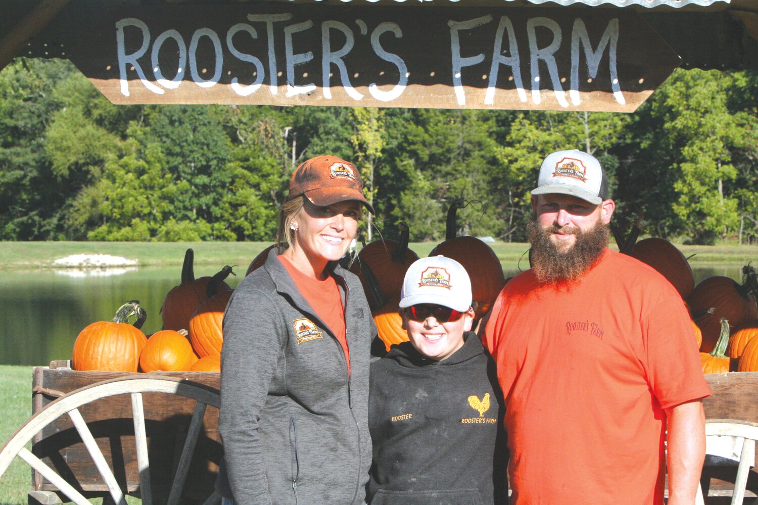 Patty, Brody and Thomas Ludy pose at Rooster’s Farm Pumpkin Patch in Jonesburg last year. The business will start its second year on Sept. 23.