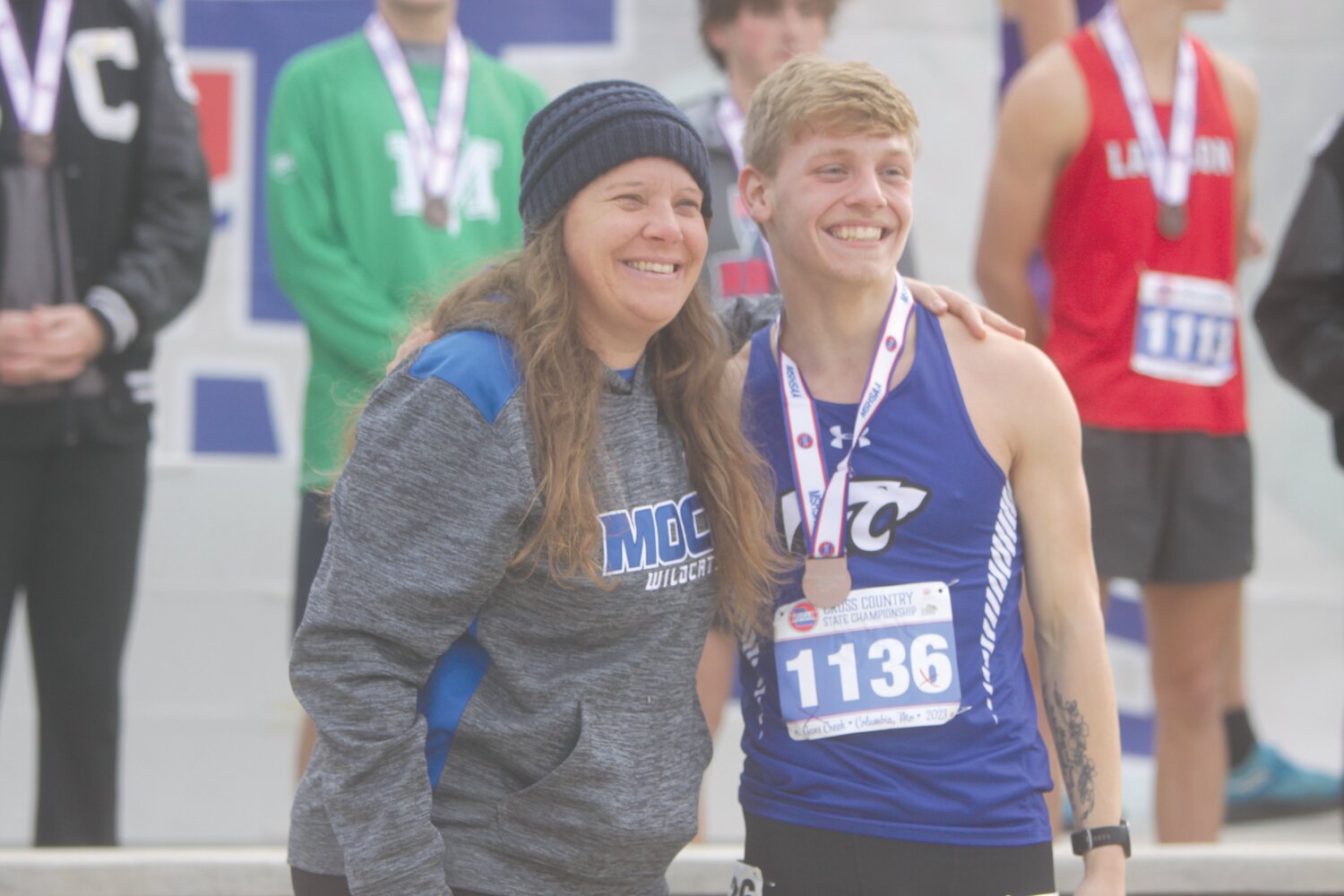 Montgomery County junior Jadrian Thurmon poses with coach Chasity Rodgers during the Class 1 boys state cross country meet awards ceremony on Nov. 4. Thurmon placed 15th for his first all-state cross country medal.