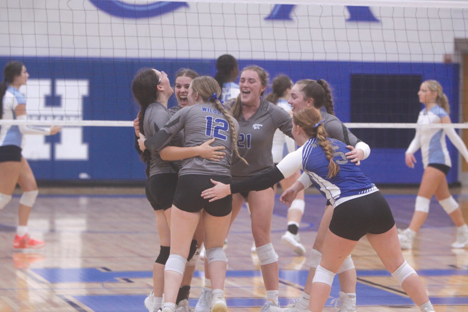 The Montgomery County volleyball team celebrates a point in the third game against Tolton Catholic in a Class 2, District 6 semifinal match on Oct. 19. The Wildcats finished their season at 12-12-4.