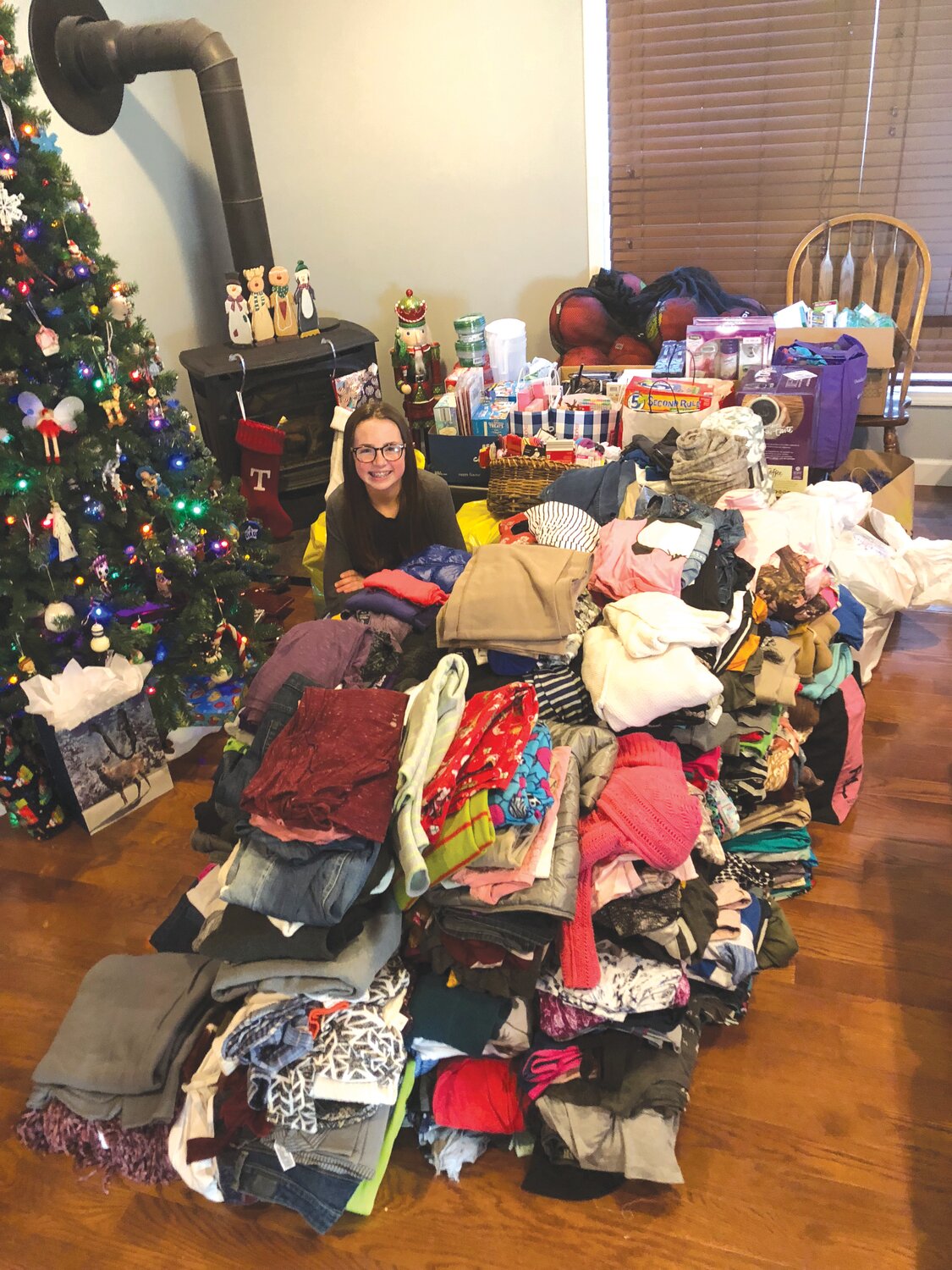 Montgomery City resident Brooke River poses with her donated items. She is having a Christmas drive to help bring joy to Missouri Girls Town residents.