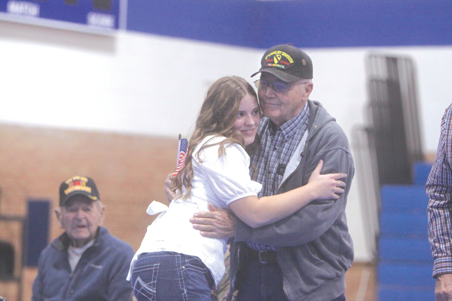Montgomery County senior Morgan Koch hugs Sam Cobb during a Veterans Day ceremony on Nov. 10 at MCHS.