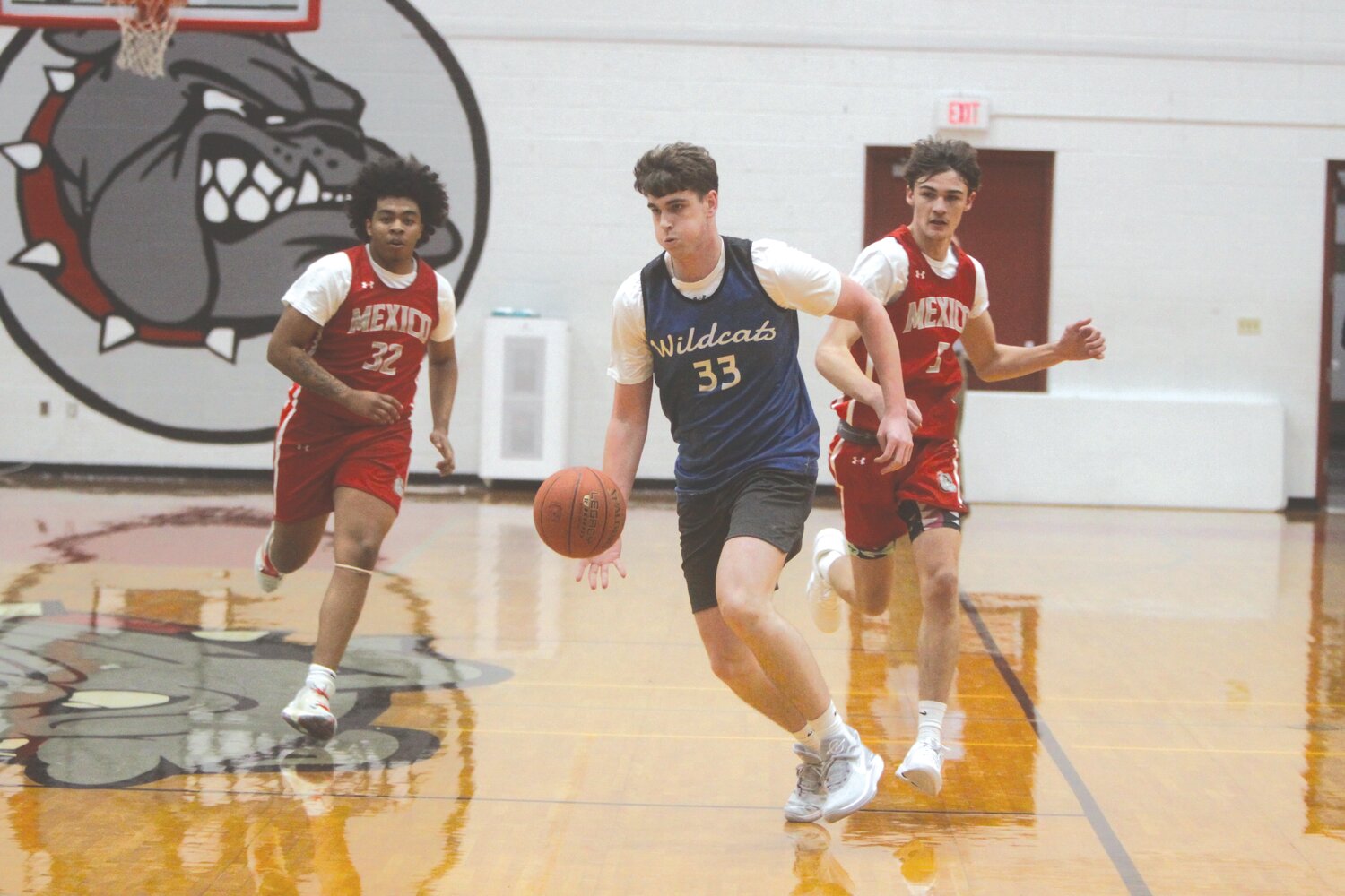 Montgomery County junior Clayton Parker dribbles at midcourt during a jamboree at Mexico High School on Nov. 13. Parker and the Wildcats are looking to finish with their fifth consecutive winning season this winter.