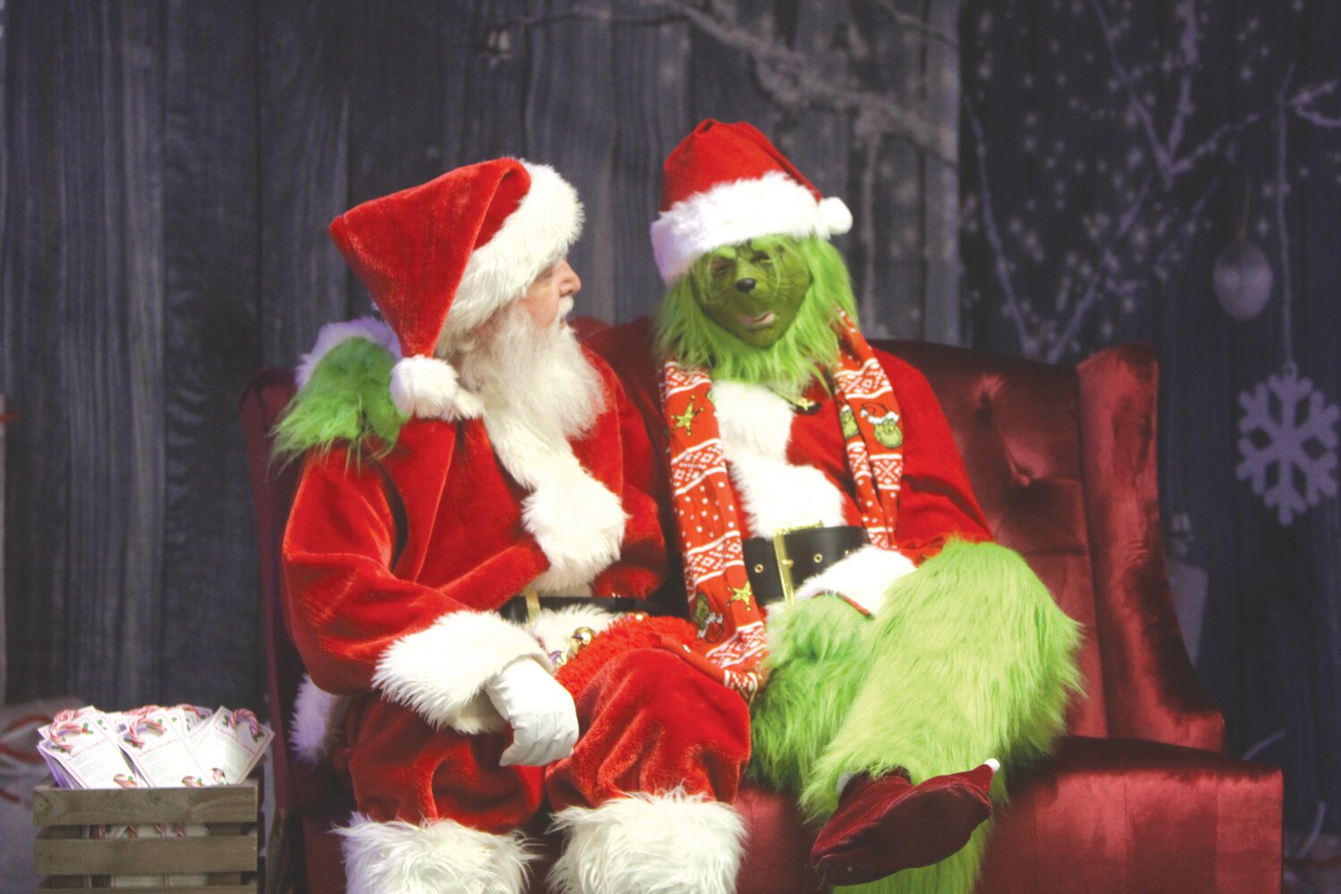 Santa Claus and the Grinch pose during a Saturday at Hometown Christmas at the Montgomery County Fairgrounds Merchants Building last year. Hometown Christmas returns from Dec. 8-10, with all businesses in Montgomery City opening late on Dec. 8.