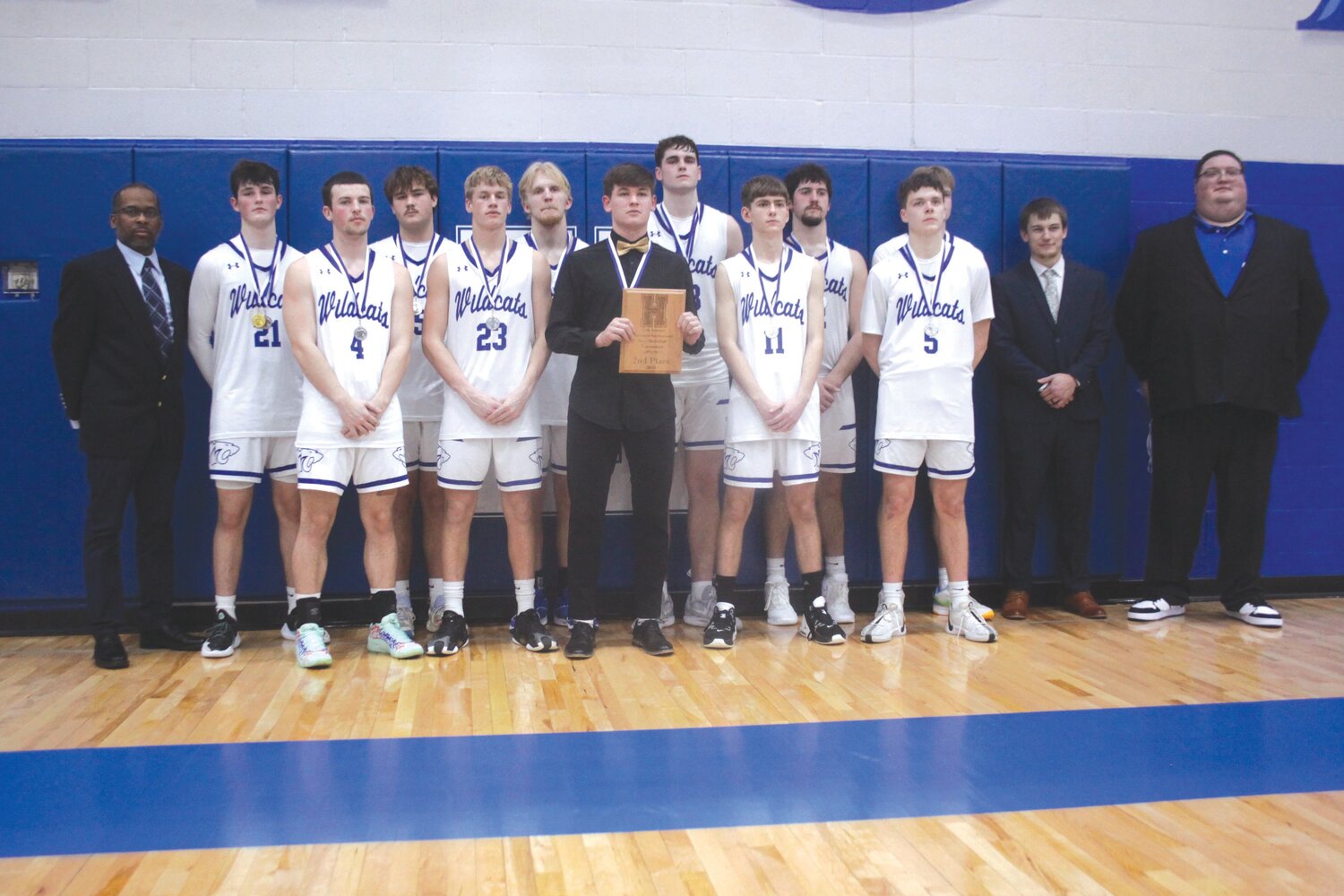 The Montgomery County boys basketball team poses with its second-place plaque after losing to Hermann 46-44 in overtime in the Hermann Invitational championship game on Jan. 27. Pictured are, front row from left, Cade Smith, Chase Queathem, Mason Leu, Seth Walton and Jay Rodgers. Back row are volunteer assistant coach Ron Williams, Jake Stellwagen, Maddox James, Tyler Erwin, Clayton Parker, Tatum Wessel, Sean Rodgers, head coach Scott Kroeger and assistant coach Dustin Figg.