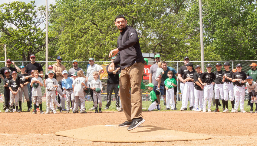 Former Pittsburgh Pirates player Jake Webb gets ready to throw the first pitch at the start of a JL Hutchinson little league game.