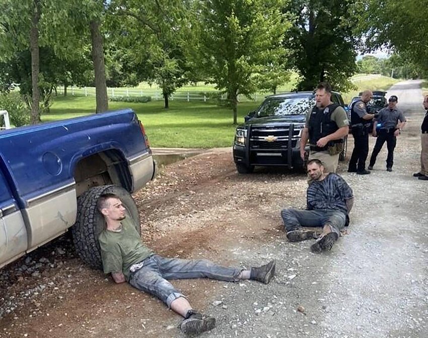 Hopkins and Martslof handcuffed following their capture.