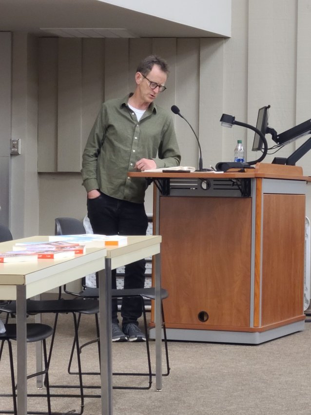 At an event at Pittsburg State University on Thursday, Author Whitney Terrell reads a scene from his novel &ldquo;The Good Lieutenant&rdquo; in which his protagonist, Emma Fowler, is dealing with her nemesis.