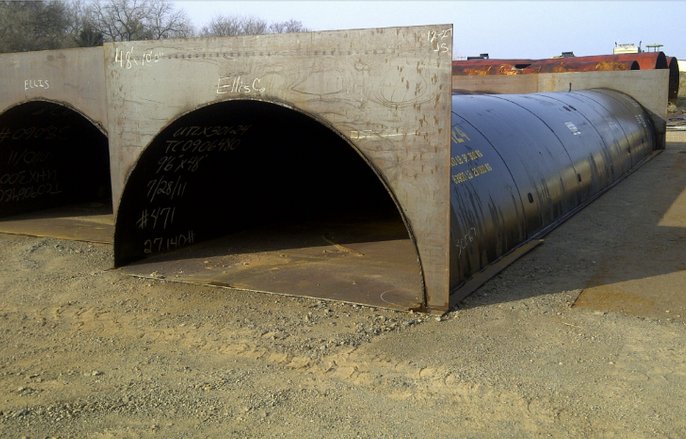 The Crawford County Commission has approved using a railroad tank car cut in half, like those shown here, for construction of a culvert to span a creek bed.