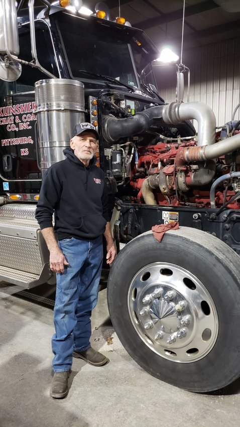 Bob Crumby, a diesel mechanic for Kunshek Chat and Coal Co., says he prefers working on the big rigs. Here, he has just finished cannibalizing one truck to get a part for another &mdash; whatever it takes to keep the fleet running.