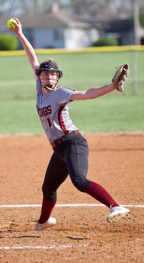 Shelby Underwood winds up to deliver a pitch against Yates Center on April 25 at Northeast high school.