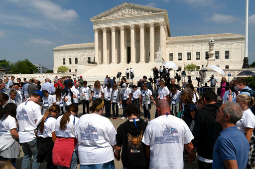 People pray outside of the U.S. Supreme Court Tuesday, May 3, 2022 in Washington. A draft opinion suggests the U.S. Supreme Court could be poised to overturn the landmark 1973 Roe v. Wade case that legalized abortion nationwide, according to a Politico report released Monday. Whatever the outcome, the Politico report represents an extremely rare breach of the court's secretive deliberation process, and on a case of surpassing importance. (AP Photo/Jose Luis Magana)