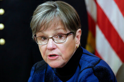 FILE - Kansas Gov. Laura Kelly speaks during an event at the Kansas Statehouse in Topeka, Kan., Thursday, March 24, 2022. Kelly has signed budget legislation that sets aside $500 million for future financial problems and gives state employees a 5% pay raise. (AP Photo/John Hanna, File)