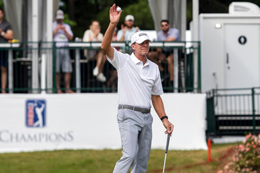 Steve Stricker waves to the fans after finishing on the 18th hole during the final day at the Regions Tradition, a PGA Tour Champions golf event, Sunday, May 15, 2022, in Birmingham, Ala. Stricker won the tournament by six strokes at 21-under par. (AP Photo/Vasha Hunt)