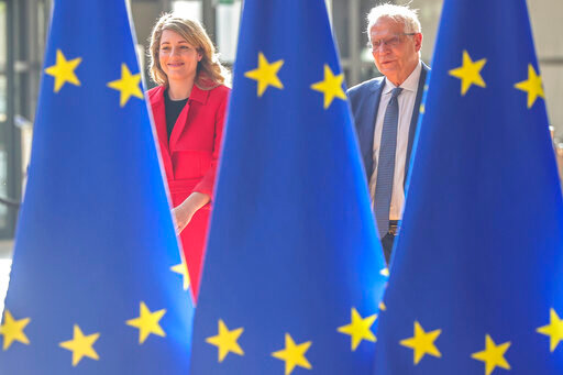 Canadian minister of foreign affairs M&eacute;lanie Joly and European Union foreign policy chief Josep Borrell arrive for a meeting of EU foreign ministers at the European Council building in Brussels, Monday, May 16, 2022. European Union foreign ministers on Monday will discuss current affairs and have an exchange of views on the Russian aggression against Ukraine and the Global Gateway. (AP Photo/Olivier Matthys)