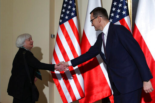 U.S. Treasury Secretary Janet Yellen, left, is greeted by Poland's Prime Minister Mateusz Morawiecki before their meeting in Warsaw, Poland, Monday, May 16, 2022. Yellen and Morawiecki will discuss how Russia's invasion of Ukraine affects Poland's economy as part of a week-long trip that also will take her to Brussels and a G7 finance leaders meeting in Germany. (AP Photo/Michal Dyjuk)