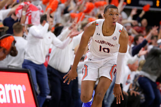 FILE - Auburn forward Jabari Smith (10) reacts after making a 3-pointer against Alabama during the first half of an NCAA college basketball game Tuesday, Feb. 1, 2022, in Auburn, Ala. Houston, Detroit and Orlando share the best odds to win the draft lottery on Tuesday, May 17, 2022, and the No. 1 pick in the NBA draft. All three are already loaded with young players, even before the possibility of adding someone like Chet Holmgren, Paolo Banchero or Jabari Smith. (AP Photo/Butch Dill, File)