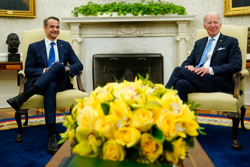 President Joe Biden, right, and Greek Prime Minister Kyriakos Mitsotakis, left, meet in the Oval Office of the White House in Washington, Monday, May 16, 2022. (AP Photo/Susan Walsh)