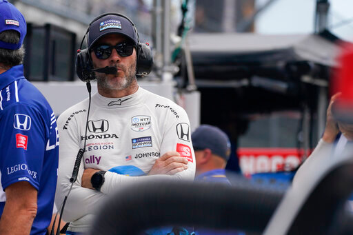 Jimmie Johnson stands on pit lane during practice for the Indianapolis 500 auto race at Indianapolis Motor Speedway, Tuesday, May 17, 2022, in Indianapolis. (AP Photo/Darron Cummings)