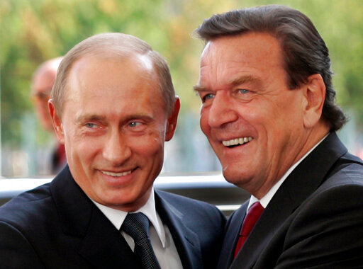 File--- File photo shows German Chancellor Gerhard Schroeder, right, welcoming Russia's President Vladimir Putin in Berlin, Germany, Thursday Sept. 8, 2005.  (AP Photo/Herbert Knosowski,file)