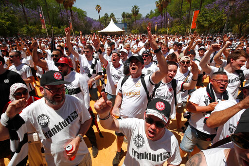 Eintracht supporters react in downtown Seville, Spain, Wednesday, May 18, 2022. Eintracht Frankfurt will play Glasgow Rangers in the Europa League final Wednesday evening in Seville. (AP Photo/Angel Fernandez)