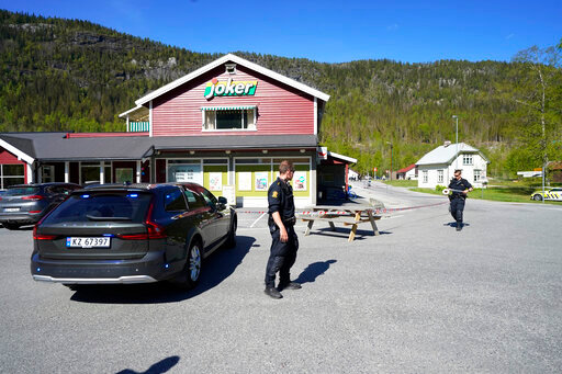 Police officers work on the scene of a multiple stabbing in Nore, Norway, Friday, May 20, 2022. Norwegian police say a person with a knife has wounded at least three people &mdash; one of them critically &mdash; in a random attack in a town near Oslo. They say the perpetrator has been arrested.(Lise &Aring;serud/NTB Scanpix via AP)