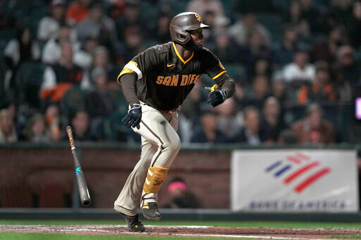 San Diego Padres' Jurickson Profar watches his RBI single against the San Francisco Giants during the 10th inning of a baseball game in San Francisco, Friday, May 20, 2022. The Padres won 8-7 in 10 innings. (AP Photo/Tony Avelar)