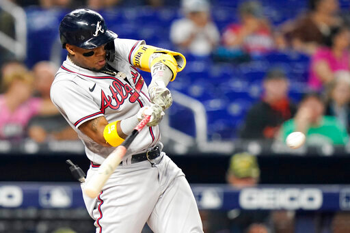 Atlanta Braves' Ronald Acuna Jr. hits a double during the first inning of the team's baseball game against the Miami Marlins, Friday, May 20, 2022, in Miami. (AP Photo/Lynne Sladky)
