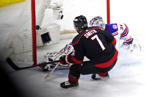 Carolina Hurricanes defenseman Brendan Smith (7) puts the puck past New York Rangers goaltender Igor Shesterkin (31) for a goal during the second period during Game 2 of an NHL hockey Stanley Cup second-round playoff series Friday, May 20, 2022, in Raleigh, N.C. (AP Photo/Chris Seward)