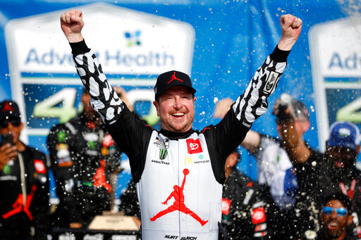 Kurt Busch celebrates in victory lane after winning a NASCAR Cup Series auto race at Kansas Speedway in Kansas City, Kan., Sunday, May 15, 2022. (AP Photo/Colin E. Braley)