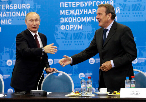 Russian President Vladimir Putin, left, and Germany's former Chancellor Gerhard Schroeder attend an economic forum in St.Petersburg, Russia, Thursday, June 21, 2012. Gerhard Schroeder left the German chancellery after a narrow election defeat in 2005 with an ambitious overhaul of the country&rsquo;s welfare state beginning to kick in and every chance of becoming a respected elder statesman. Fast-forward to last week: German lawmakers agreed to shut down Schroeder&rsquo;s taxpayer-funded office, the European Parliament called for him to be sanctioned, and his own party set a mid-June hearing on applications to have him expelled. Schroeder&rsquo;s association with the Russian energy sector turned the 78-year-old into a political pariah in Germany after the invasion of Ukraine. (AP Photo/Dmitry Lovetsky, pool)
