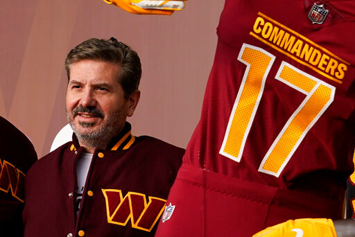 FILE - Dan Snyder, co-owner and co-CEO of the Washington Commanders, poses for photos during an event to unveil the NFL football team's new identity, Wednesday, Feb. 2, 2022, in Landover, Md. A person with knowledge of the situation tells The Associated Press the Washington Commanders have bought land in Virginia for what could be a potential site of the NFL team&rsquo;s next stadium. The 200 acres of land purchased for approximately $100 million is in Woodbridge roughly 25 miles outside the District of Columbia. The Commanders&rsquo; lease at FedEx Field in Landover, Maryland, expires in 2027. (AP Photo/Patrick Semansky, File)
