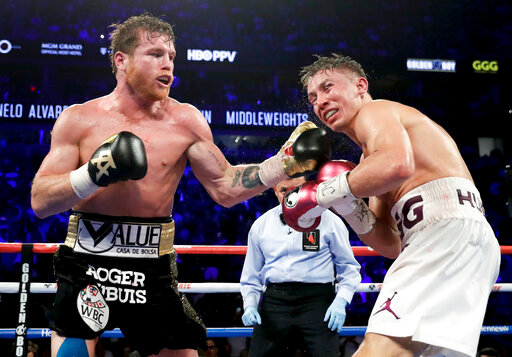 FILE - Canelo &Aacute;lvarez lands a punch against Gennadiy Golovkin in the 12th round during a middleweight title boxing match, Saturday, Sept. 15, 2018, in Las Vegas. Alvarez won by majority decision. &Aacute;lvarez and Golovkin will resume their rivalry Sept. 17 after a four-year break, promoter Matchroom announced Tuesday, May 24, 2022. (AP Photo/Isaac Brekken, File)