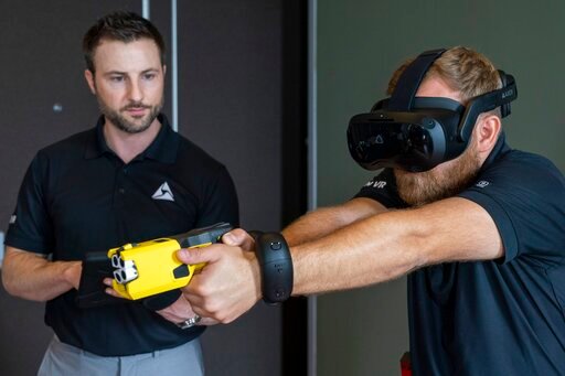 VR equipment and a version of the TASER 7 that utilizes VR technology for training, is demonstrated, Thursday, May 12, 2022, in Washington. (AP Photo/Jacquelyn Martin)
