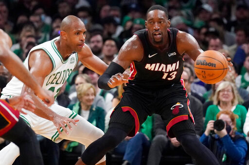 Miami Heat center Bam Adebayo (13) is pressured byBoston Celtics center Al Horford, left, during the second half of Game 4 of the NBA basketball playoffs Eastern Conference finals, Monday, May 23, 2022, in Boston. (AP Photo/Charles Krupa)