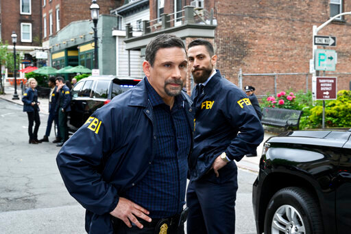 This image released by CBS shows Jeremy Sisto as Assistant Special Agent in Charge Jubal Valentine and Zeeko Zaki as Special Agent Omar Adom &quot;OA&quot; Zidan in a scene from the season finale of  the series &quot;FBI.&quot; CBS has pulled the season finale episode after a deadly elementary school shooting in Texas. (David M. Russell/CBS via AP)