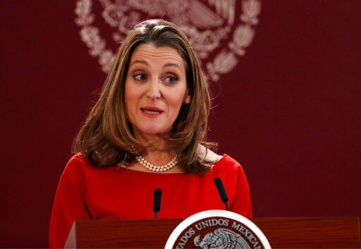 FILE - Deputy Prime Minister of Canada Chrystia Freeland speaks during an event to sign an update to the North American Free Trade Agreement, at the national palace in Mexico City, Dec. 10. 2019. Western allies are considering whether to allow Russian oligarchs to buy their way out of sanctions and using the money to rebuild Ukraine, according to government officials familiar with the matter. Canadian Deputy Prime Minister and Finance Minister Chrystia Freeland proposed the idea at a G-7 finance ministers' meeting in Germany last week. (AP Photo/Marco Ugarte, file)