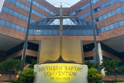 A cross and Bible sculpture stand outside the Southern Baptist Convention headquarters in Nashville, Tenn., on Tuesday, May 24, 2022. On Tuesday, top administrative leaders for the SBC, the largest Protestant denomination in America, said that they will release a secret list of hundreds of pastors and other church-affiliated personnel accused of sexual abuse. (AP Photo/Holly Meyer)