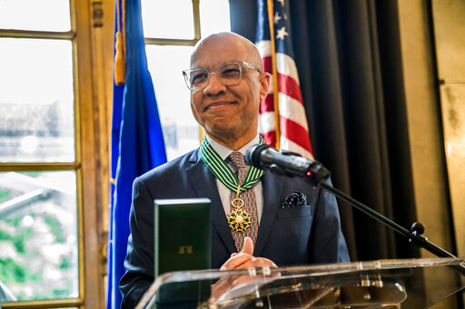 This photo provided by Ford Foundation shows Darren Walker, the president of the Ford Foundation receiving France&rsquo;s highest cultural honor in recognition of his support of the arts and artists on Tuesday, May 24, 2022 at the French embassy in New York.  &ldquo;Being in this firmament is absolutely humbling,&rdquo; Walker told The Associated Press. &ldquo;I&rsquo;m simply a servant to the idea of art and justice in the world, because we can&rsquo;t have justice without art.&rdquo;    (Kisha Bari/Ford Foundation via AP)