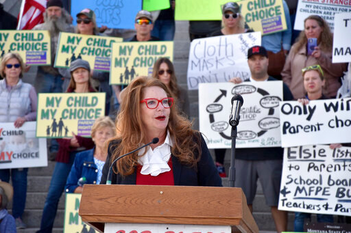 FILE - Superintendent of Public Instruction Elsie Arntzen speaks at a rally opposing mask requirements in schools in front of the state capitol in Helena, Mont., on Oct. 1, 2021. Arntzen was cited on Thursday, May 26, 2022, for illegally passing a school bus in a residential subdivision the previous week. While Arntzen said she did not recall the incident, she thanked the school bus driver who reported the incident for his vigilance. (AP Photo/Iris Samuels, File)