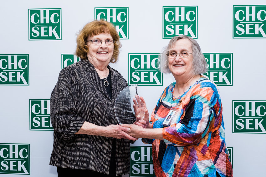 CHCSEK board member Judy Westhoff, left, stands with CHCSEK CEO Krista Postai after receiving the Sheridan Award on Thursday during the health center&rsquo;s annual Employee Service Awards Recognition Banquet. Next year, a new award will be given called &ldquo;The Judy,&rdquo; named after Westhoff.