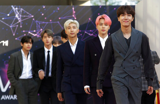 FILE -In this April 24, 2019, photo, members of South Korean K-Pop group BTS arrive to attend The Fact Music Awards in Incheon, South Korea. BTS will reveal their gradual journey to becoming K-pop superstars through a new Apple Music weekly limited series. The streaming service announced Thursday, May 26, 2022 that BTS will launch their new show &ldquo;BTS Radio: Past &amp; Present&rdquo; on Apple Music 1. (AP Photo/Ahn Young-joon, File)