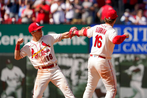 St. Louis Cardinals' Nolan Gorman (16) and Tommy Edman (19) celebrate an 8-3 victory over the Milwaukee Brewers in a baseball game Saturday, May 28, 2022, in St. Louis. (AP Photo/Jeff Roberson)