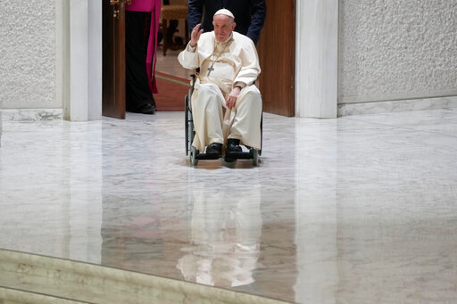 Pope Francis arrives in the Paul VI hall to meet with Italian members of the Cursillos de Cristianidad movement at the Vatican, Saturday, 28, 2002. (AP Photo/Gregorio Borgia)