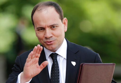 FILE - President of the Republic of the Albania Bujar Nishani waves to journalists during ceremony of welcoming delegation of Brdo Brijuni leaders meeting in Sarajevo, Bosnia on Sunday, May 29, 2016. Albania says former President Bujar Nishani has died at 55 following a serious health problem. President Ilir Meta wrote on Facebook that he had learned &ldquo;with sadness and deep regret that President Bujar Nishani passed away&rdquo; on Saturday, May 28, 2022.  (AP Photo/Amel Emric, File)