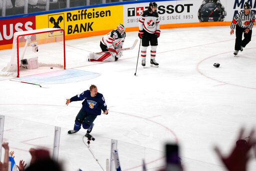 Finland's Sakari Manninen reacts to his game-winning goal during the Hockey World Championship final match between Finland and Canada, Sunday May 29, 2022, in Tampere, Finland. Finland won 4-3 in overtime. (AP Photo/Martin Meissner)