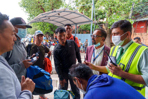 A team of climbers prepare to leave for rescue operations from the Tribhuvan International Airport in Kathmandu, Nepal, Sunday, May 29, 2022. A small airplane with 22 people on board flying on a popular tourist route was missing in Nepal&rsquo;s mountains on Sunday, an official said. The Tara Airlines plane, which was on a 15-minute scheduled flight to the mountain town of Jomsom, took off from the resort town of Pokhara, 200 kilometers (125 miles) east of Kathmandu. It lost contact with the airport tower shortly after takeoff. (AP Photo/Niranjan Shreshta)