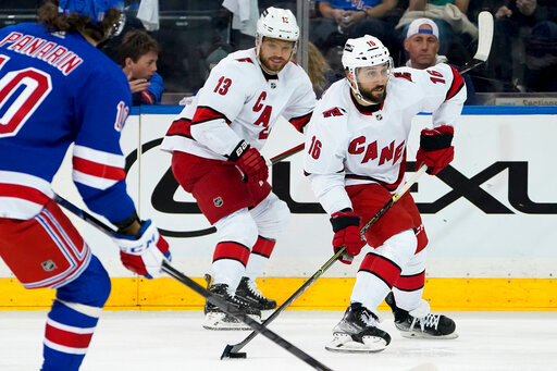 Carolina Hurricanes center Vincent Trocheck (16) sets up a shot on goal during the second period of Game 6 of an NHL hockey Stanley Cup second-round playoff series against the New York Rangers, Saturday, May 28, 2022, in New York. (AP Photo/John Minchillo)