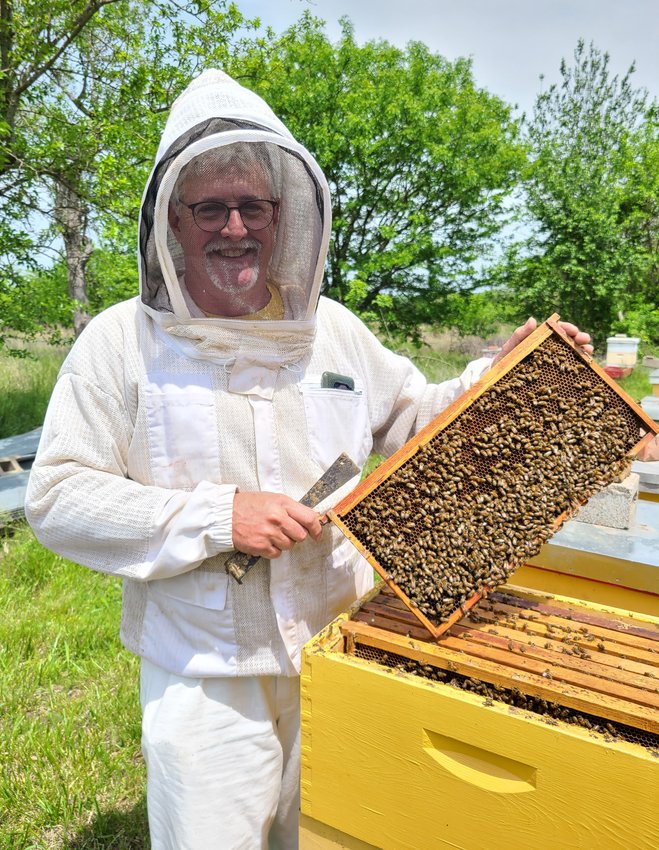 Dan Mosier II has been beekeeping for many years, and has become a mentor for several new beekeepers.